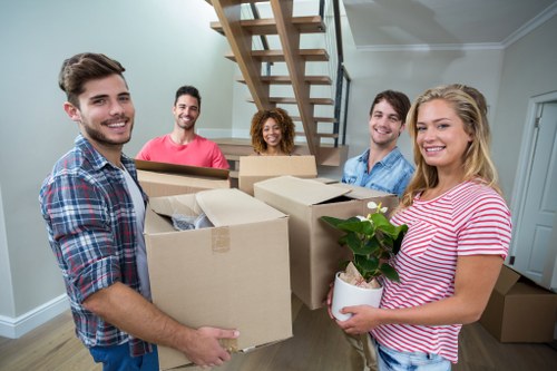 Moving team handling apartment relocation in Richmond on a busy street
