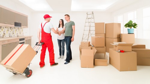 Furniture and boxes being secured inside a removal van