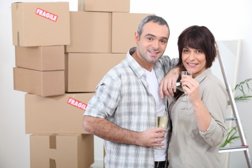 Movers transporting furniture through an apartment building in Richmond
